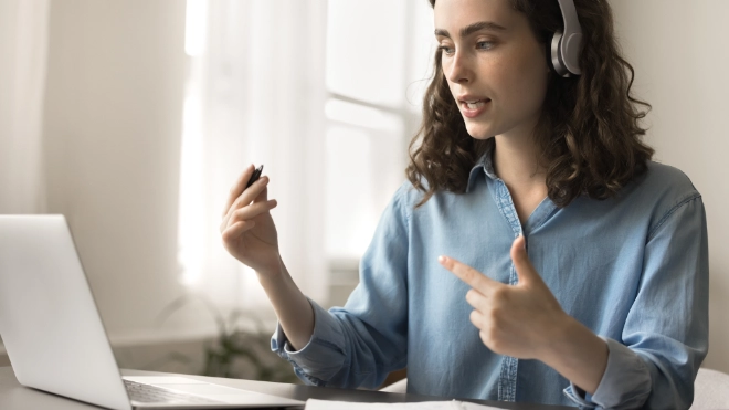 woman at laptop with a headset