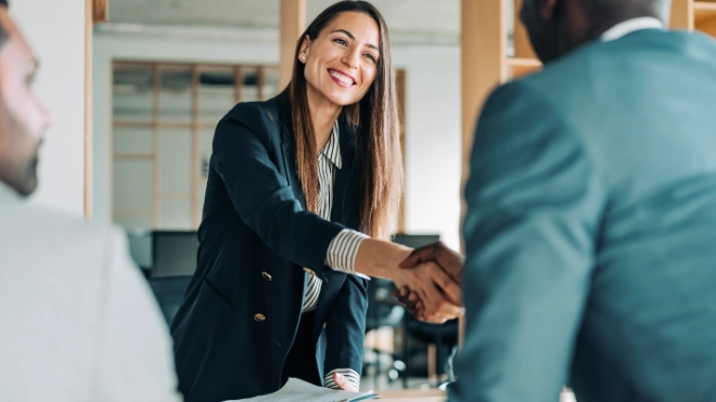 woman shakes hand of man
