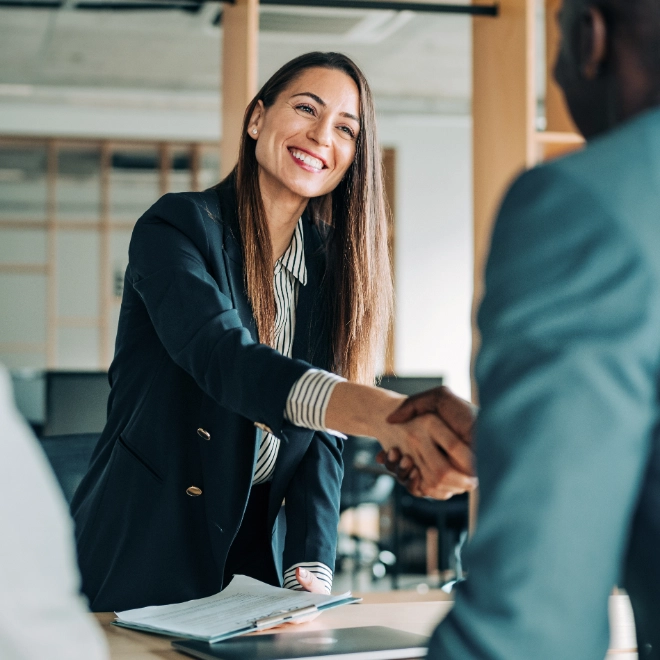 woman shakes hand of man